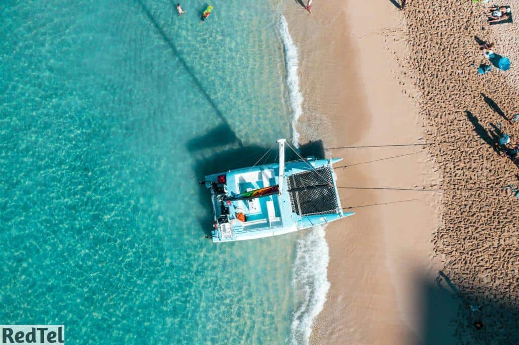 White and Blue Boat on Sea