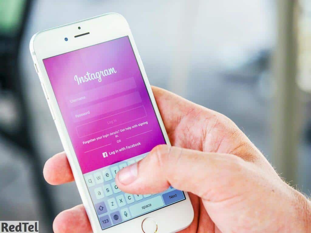 Person Holding Phone While Logging-in on Instagram Application